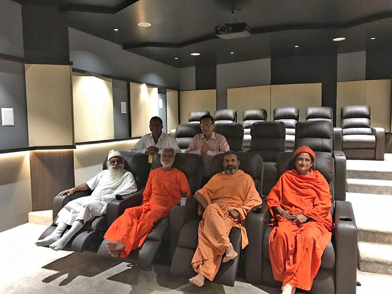 Group of Swamis and devotees in media room